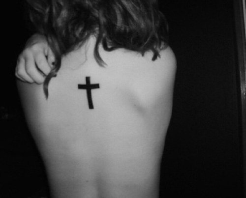 black cross tattoo on back